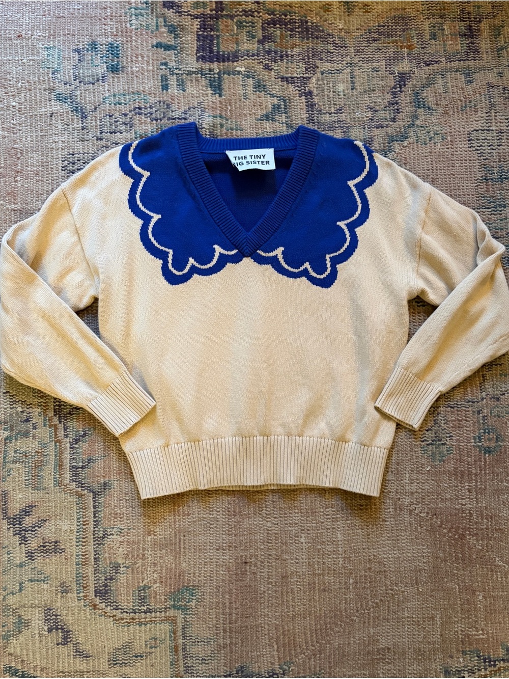 The Tiny Big Sister Cream V‑Neck Sweater with Blue Scallop Collar